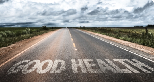 Open road with 'GOOD HEALTH' message